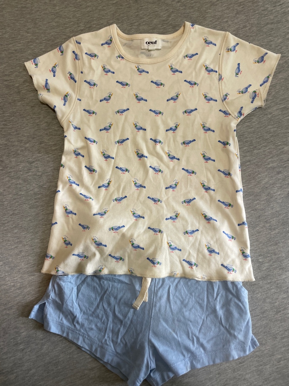 Oeuf tee with Blue pigeon with baguette Print and Light Blue Shorts.